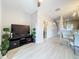 Bright living room with stairs, half bath, and view to dining area at 3309 Wilshire Way Rd # 3, Orlando, FL 32829