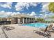 Resort-style pool area with ample seating, perfect for relaxation and community gatherings under sunny skies at 3309 Wilshire Way Rd # 3, Orlando, FL 32829