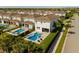 Backyard aerial view showcasing a sparkling pool, spa, and outdoor seating area at 341 Burma St, Kissimmee, FL 34747