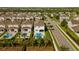 An aerial view of the back of a home, with a pool, spa, and manicured hedges in the backyard at 341 Burma St, Kissimmee, FL 34747