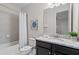 Cozy bathroom with granite vanity, a shower-tub combo, and neutral decor at 341 Burma St, Kissimmee, FL 34747