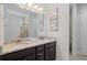 Bathroom with granite double vanity and large mirror at 341 Burma St, Kissimmee, FL 34747