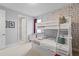 Bright bedroom with a bunk bed and a Mickey Mouse themed wallpaper at 341 Burma St, Kissimmee, FL 34747