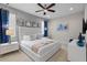 Bright bedroom with a plush bed, stylish mirror decor, and a soothing color palette at 341 Burma St, Kissimmee, FL 34747