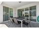 Outdoor patio area with a dining table and chairs, offering a relaxing space for entertaining and enjoying the fresh air at 341 Burma St, Kissimmee, FL 34747