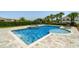 Inviting swimming pool and spa area surrounded by a spacious patio and well-manicured landscaping at 341 Burma St, Kissimmee, FL 34747