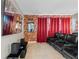 A fantastic theater room with tiered leather seating, brick wall, and large projector screen at 341 Burma St, Kissimmee, FL 34747