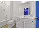 Bright bathroom featuring a shower-tub combination, toilet, and vanity with granite countertop and a large mirror at 3860 Sonoma Blvd, Kissimmee, FL 34741