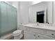 Clean bathroom featuring white vanity, shower with curtain, and coordinated fixtures at 3860 Sonoma Blvd, Kissimmee, FL 34741