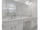 Modern bathroom with a double vanity, granite countertop, and large mirror at 3860 Sonoma Blvd, Kissimmee, FL 34741