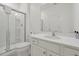 Bright bathroom with white vanity, quartz countertop, a glass shower and marble-look tile floors at 3860 Sonoma Blvd, Kissimmee, FL 34741