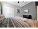 Comfortable bedroom featuring plush bedding and neutral decor for a relaxing ambiance at 3860 Sonoma Blvd, Kissimmee, FL 34741