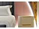 A well-lit bedroom featuring a plush bed with decorative headboard and modern nightstand at 3860 Sonoma Blvd, Kissimmee, FL 34741