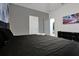 Modern bedroom with a sleek black bed, dresser, and a relaxing atmosphere at 3860 Sonoma Blvd, Kissimmee, FL 34741