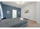 Bedroom features a TV, light gray walls, and an attached bathroom at 3860 Sonoma Blvd, Kissimmee, FL 34741