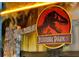 Jurassic Park themed sign with dramatic lighting effects and rock decor at 3860 Sonoma Blvd, Kissimmee, FL 34741