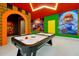 Fun game room featuring colorful decor and an air hockey table for hours of entertainment at 3860 Sonoma Blvd, Kissimmee, FL 34741