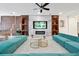 Bright living room featuring modern decor, including a fireplace, sectional sofa, and sleek marble floors at 3860 Sonoma Blvd, Kissimmee, FL 34741