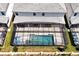 Aerial view of a screened-in pool with chairs in the backyard of a home at 3860 Sonoma Blvd, Kissimmee, FL 34741
