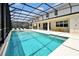 Large backyard screened-in pool and hot tub perfect for relaxation and entertaining at 3860 Sonoma Blvd, Kissimmee, FL 34741