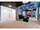 Home theater with black leather seating and spaceship-themed decor at 3860 Sonoma Blvd, Kissimmee, FL 34741