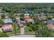 Aerial view of home and surrounding neighborhood near a scenic lake at 4019 Lake Mirage Blvd, Orlando, FL 32817