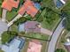 Aerial view of property line showcasing home, lush landscaping, and neighborhood at 4019 Lake Mirage Blvd, Orlando, FL 32817