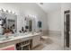 Well-lit bathroom with double sinks, a large mirror, and a shower/tub combo, providing ample space and functionality at 4019 Lake Mirage Blvd, Orlando, FL 32817