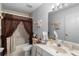 Bathroom features a toilet, a sink, and a shower-tub combo, with neutral tones for a relaxing experience at 4019 Lake Mirage Blvd, Orlando, FL 32817