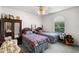 Comfortable bedroom with two twin beds, a ceiling fan, an arched window, and cozy decor at 4019 Lake Mirage Blvd, Orlando, FL 32817
