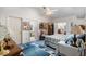 Bright bedroom with a ceiling fan, TV, striped comforter, and an ensuite bathroom for added convenience at 4019 Lake Mirage Blvd, Orlando, FL 32817
