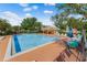 Community pool area with lounge chairs, picnic area, and shaded pavilion at 4019 Lake Mirage Blvd, Orlando, FL 32817