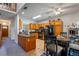 Open-concept kitchen features wood cabinets, black appliances, and a cozy breakfast nook at 4019 Lake Mirage Blvd, Orlando, FL 32817