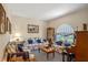 Comfortable living room featuring plush sofas, large windows, and ample natural light at 4019 Lake Mirage Blvd, Orlando, FL 32817