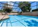 Inviting screened-in pool perfect for relaxation and outdoor entertaining with ample space at 4019 Lake Mirage Blvd, Orlando, FL 32817