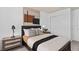 Comfortable bedroom featuring a cozy bed, sliding closet doors, and modern decor at 4568 Maple Waltz Aly, Clermont, FL 34714