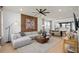 Open-concept living room with modern decor and wood accent wall at 4568 Maple Waltz Aly, Clermont, FL 34714