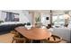 Bright living room features hardwood floors, modern furnishings, and a dining table, creating a welcoming space at 4568 Maple Waltz Aly, Clermont, FL 34714