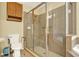 This bathroom features a tiled glass enclosed shower with a handheld shower head and a built-in bench at 4571 Abaco Dr, Tavares, FL 32778