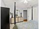 This bedroom features a four-poster bed, plush carpet, and white closet doors at 4571 Abaco Dr, Tavares, FL 32778