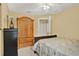 Neutral bedroom showcases twin closets, neutral carpet, and a ceiling fan at 4571 Abaco Dr, Tavares, FL 32778