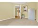 Bedroom showcasing neutral carpet, light yellow walls, and an open doorway to another room at 4571 Abaco Dr, Tavares, FL 32778
