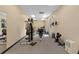 Gym featuring weight-lifting equipment, and cardio machines with mirrors and ceiling lighting at 4571 Abaco Dr, Tavares, FL 32778