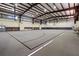 Indoor gymnasium featuring a basketball court, high ceilings, and ample space at 4571 Abaco Dr, Tavares, FL 32778