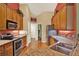 Modern kitchen features wood cabinets, granite countertops, and stainless-steel appliances at 4571 Abaco Dr, Tavares, FL 32778