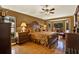 Comfortable main bedroom features a bay window, hardwood floors, and a ceiling fan at 4571 Abaco Dr, Tavares, FL 32778