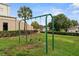 Community playground with swings set amidst well-maintained landscaping, providing a safe and fun area for children to play at 4571 Abaco Dr, Tavares, FL 32778
