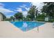 Sparkling community swimming pool with clear blue water and surrounding lounge chairs at 4571 Abaco Dr, Tavares, FL 32778