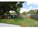 A large backyard with a shed and a wooden fence offers plenty of space for outdoor activities at 5805 Hutton Dr, Orlando, FL 32808