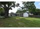 Charming single-story home with a stone facade and a well-manicured front yard at 5805 Hutton Dr, Orlando, FL 32808